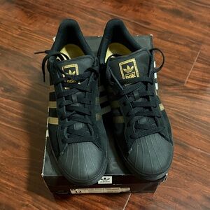 Adidas Black Sneakers with Gold Details
